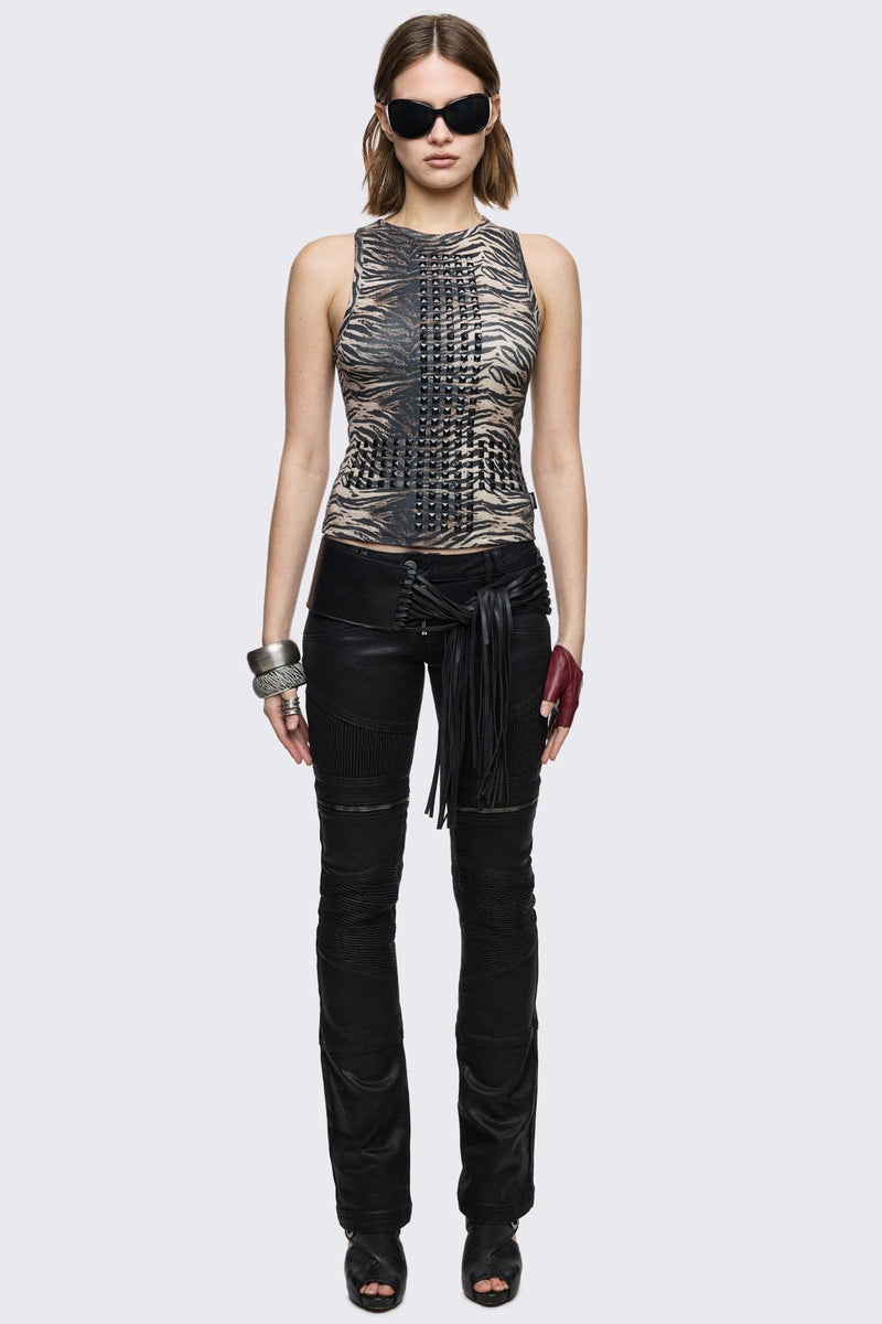Bootcut jeans in black coated denim with ribbed paneling and zipper details, low-rise grunge aesthetic.