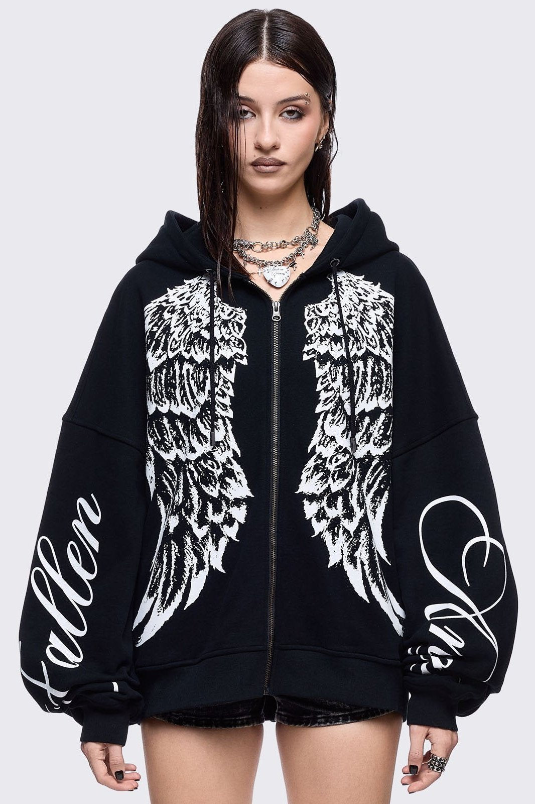 Black zip up hoodie jacket featuring a white wings graphic front print and "fallen angel" on sleeves
