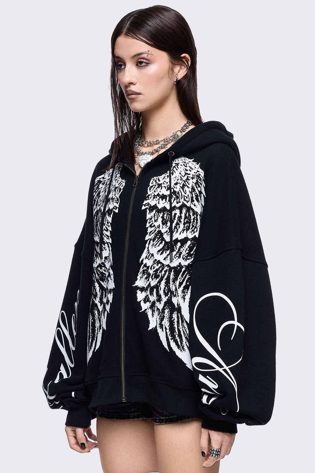 Black zip up hoodie jacket featuring a white wings graphic front print and "fallen angel" on sleeves