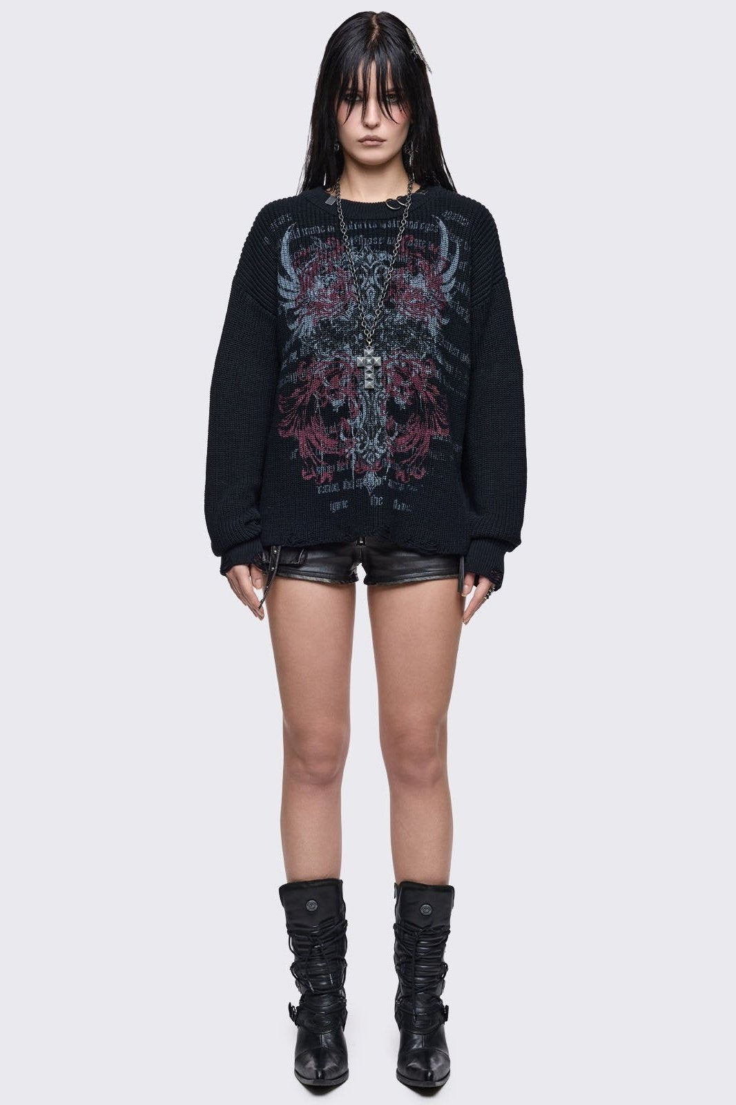 Black knitted distressed jumper with grunge graphic design and stud and O-ring details.