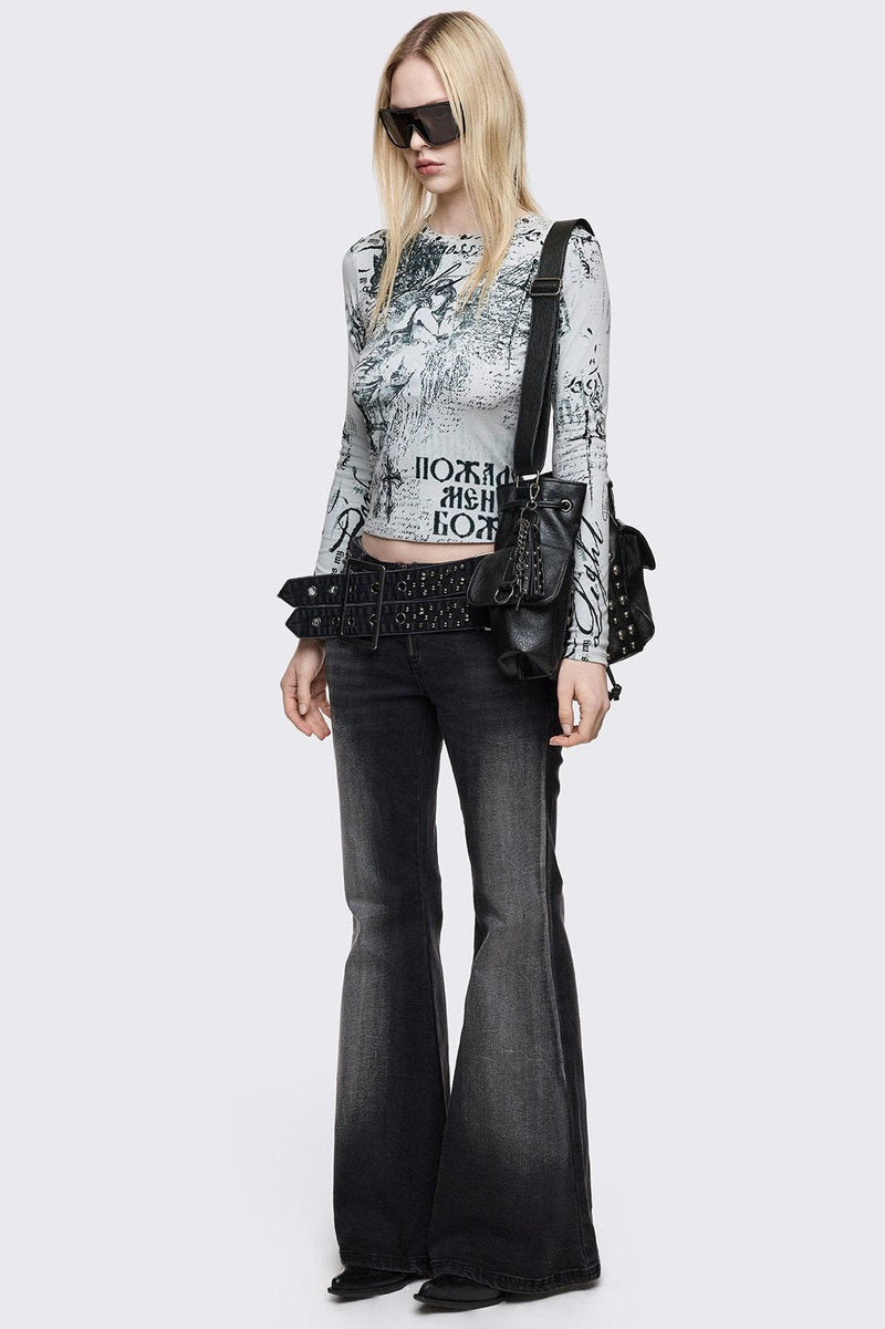 Grey washed flared jeans with double-buckle belt.