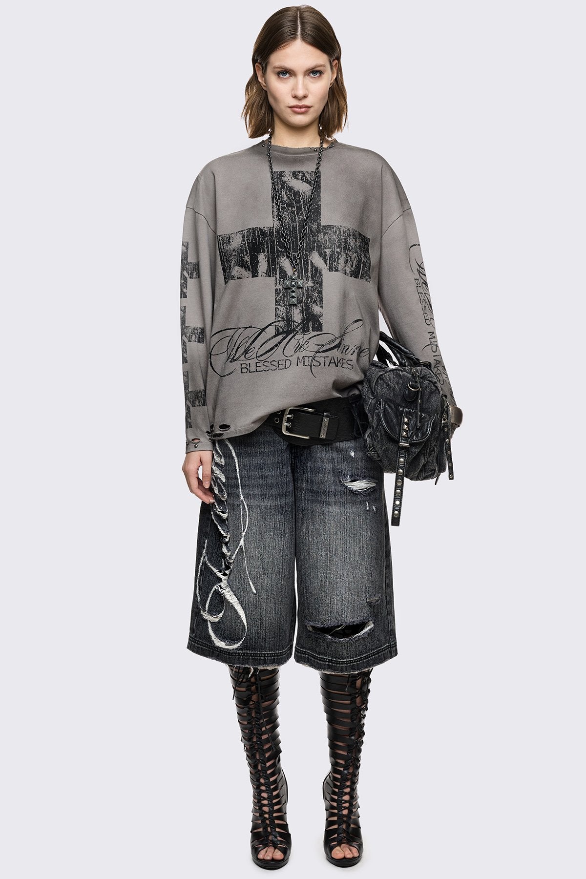 Grey cotton long sleeve T-shirt with cross graphic, studs and distressed hem in a grunge goth style.