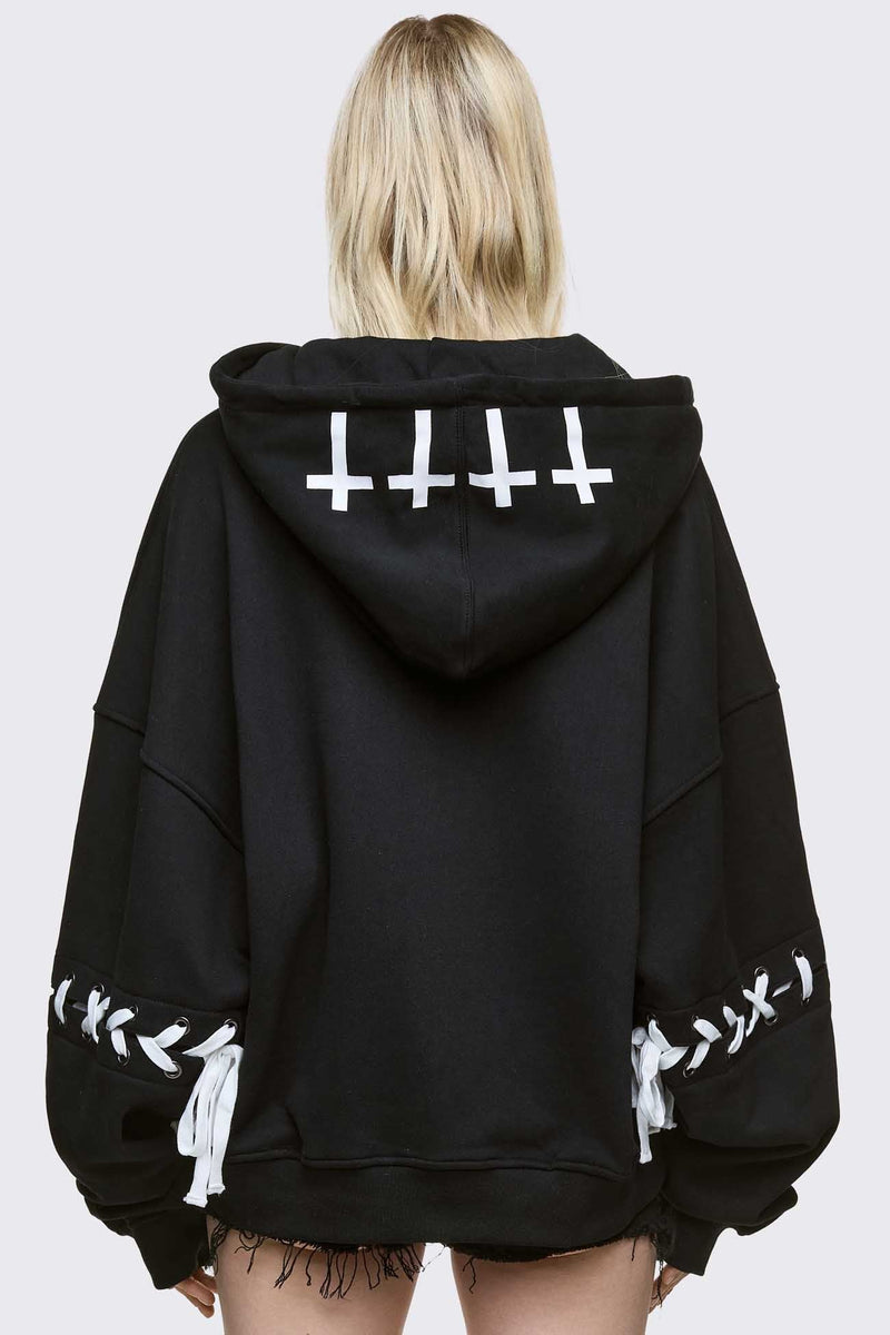 Black zip up hoodie jacket with "Every angels terrifying" graphic print and white lace-up details.