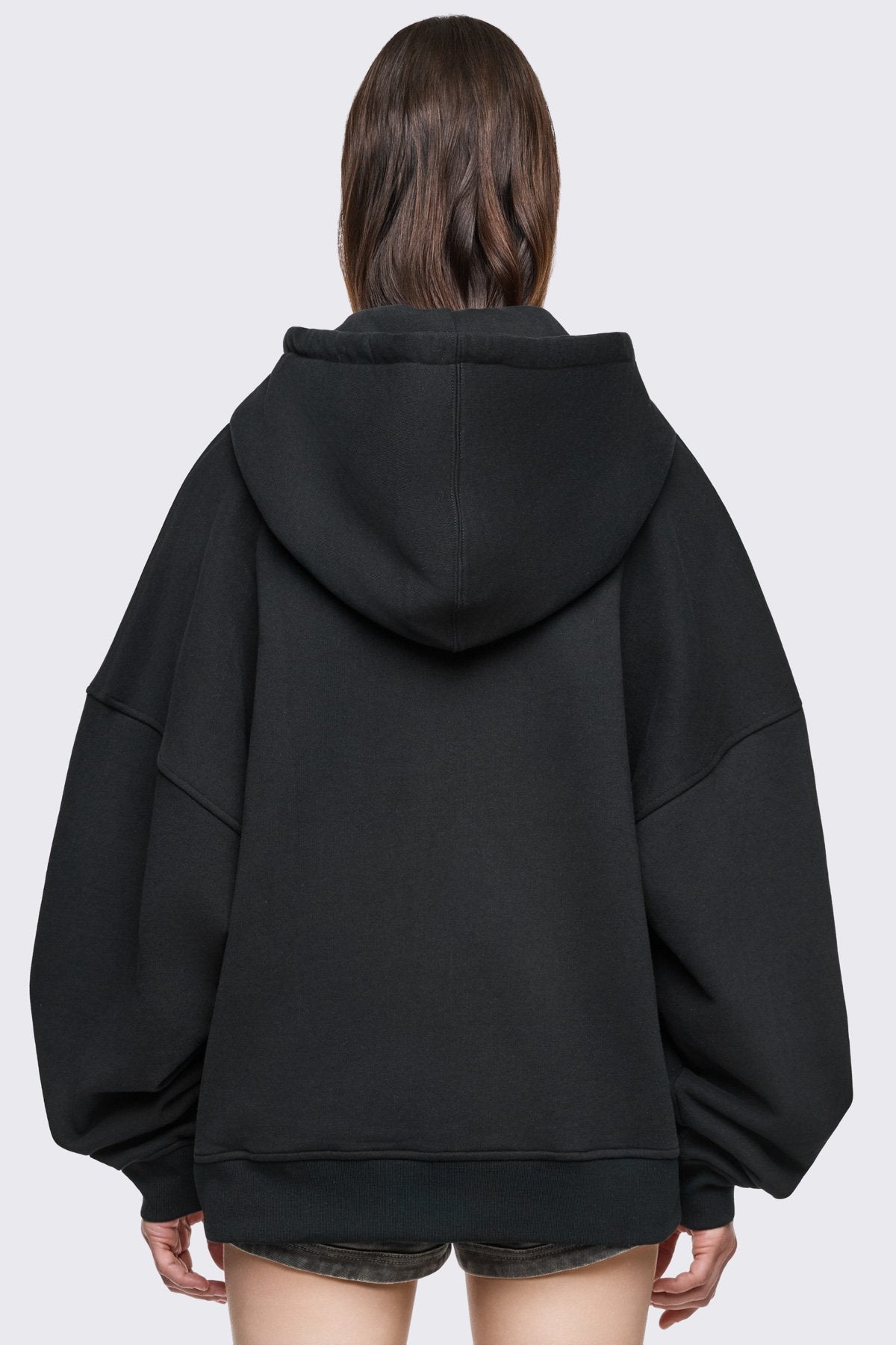 Black cotton zip-up hoodie with studded Angel Club design, oversized fit and grunge streetwear vibe.