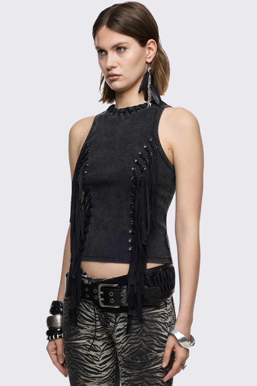 Black washed ribbed cotton tank top with lace-up eyelets and long hanging ties, slim grunge aesthetic.