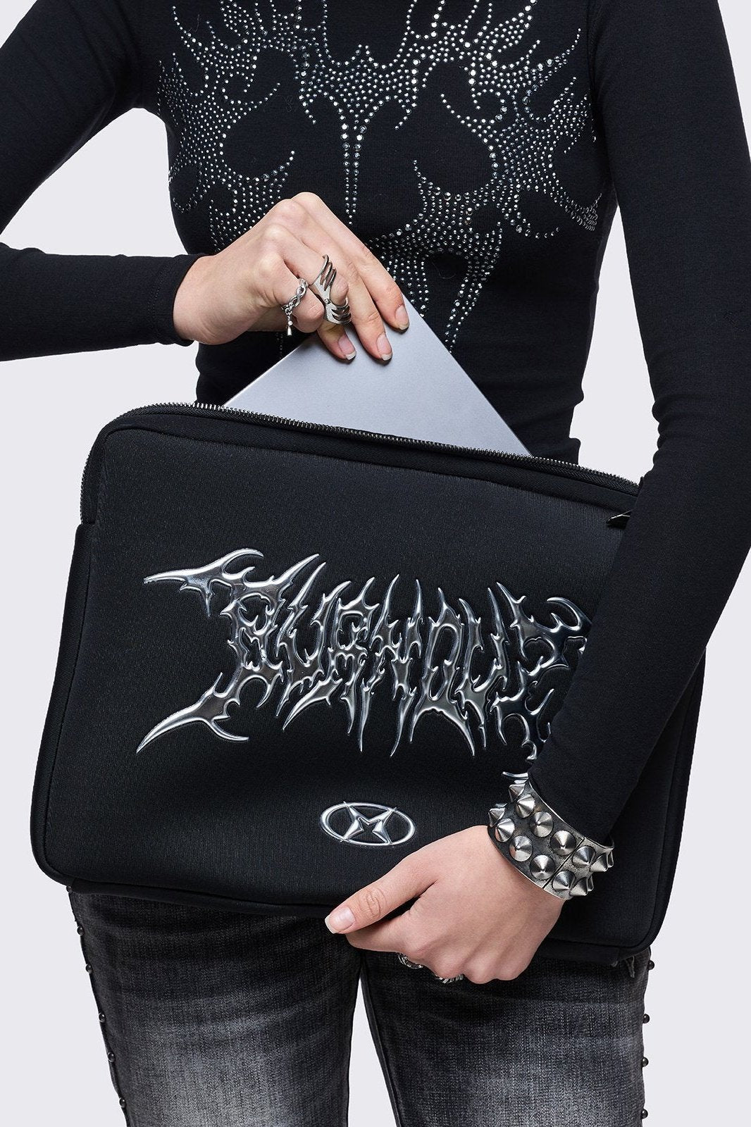 Black laptop sleeve bag with "burnout" sigilism design.