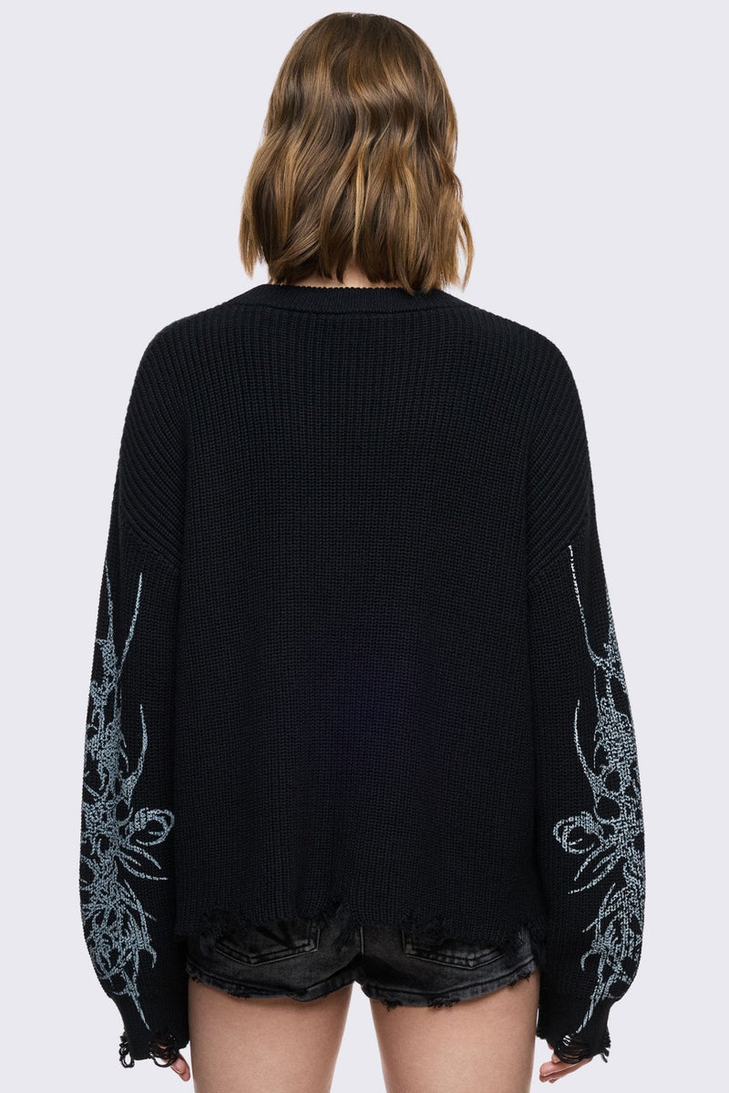 Black knitted jumper with cross sigilism graphic design and distressed rib 