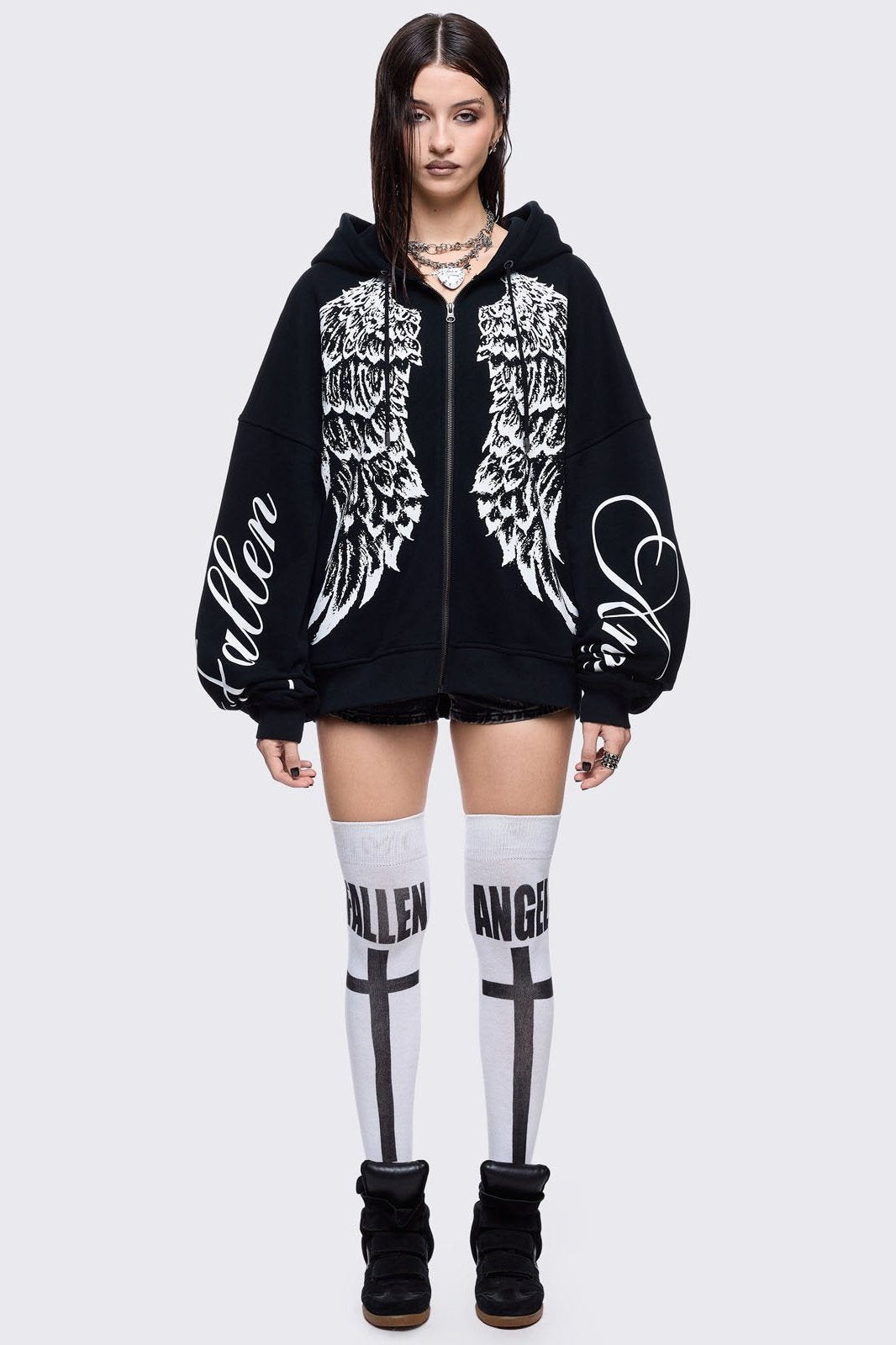 Black zip up hoodie jacket featuring a white wings graphic front print and "fallen angel" on sleeves