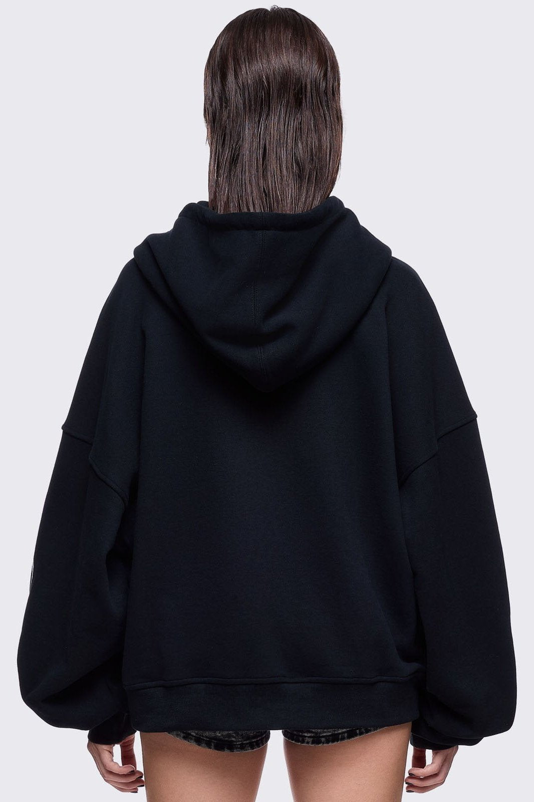 Black zip up hoodie jacket featuring a white wings graphic front print and "fallen angel" on sleeves