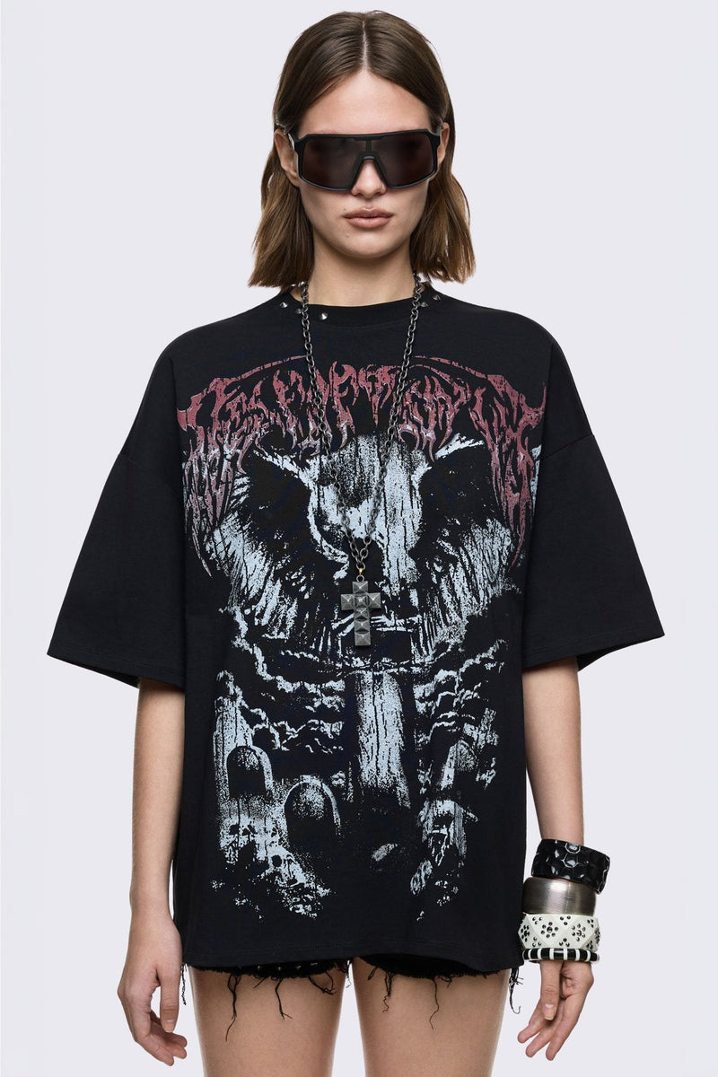Black cotton T-shirt with dark front graphic print, relaxed fit, and grunge aesthetic.