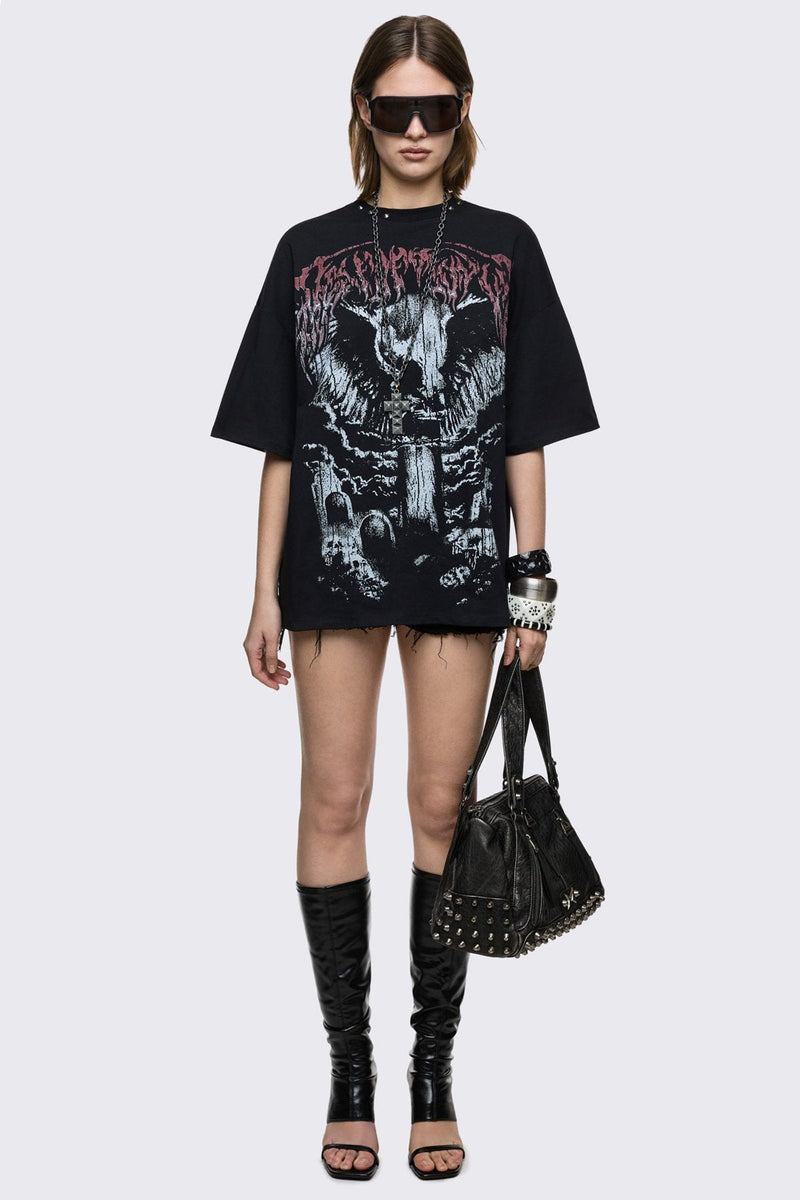 Black cotton T-shirt with dark front graphic print, relaxed fit, and grunge aesthetic.
