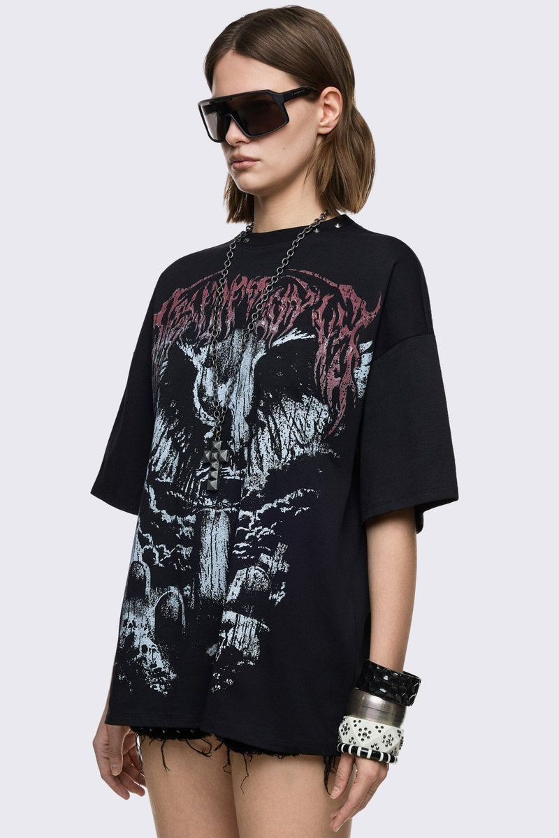 Black cotton T-shirt with dark front graphic print, relaxed fit, and grunge aesthetic.