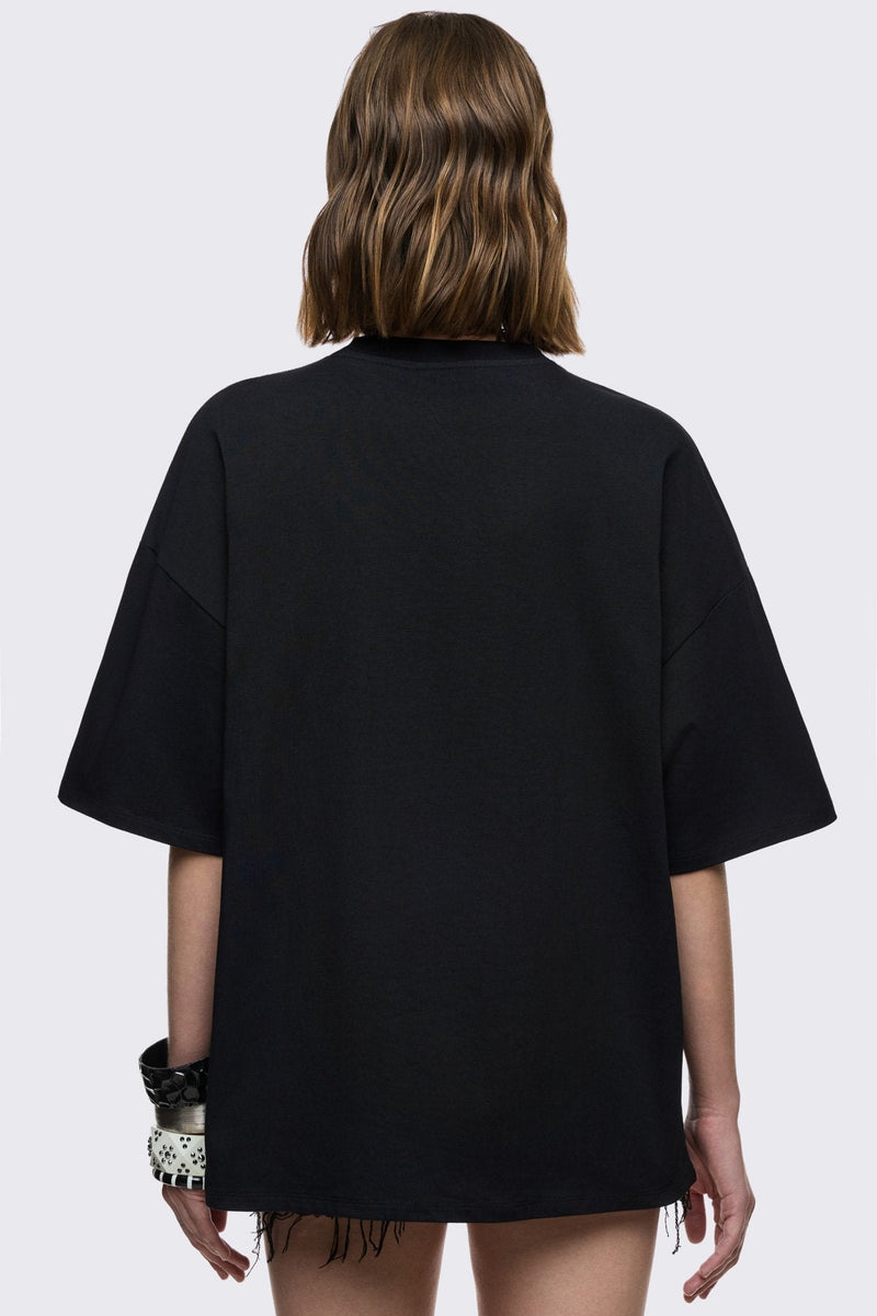 Black cotton T-shirt with dark front graphic print, relaxed fit, and grunge aesthetic.