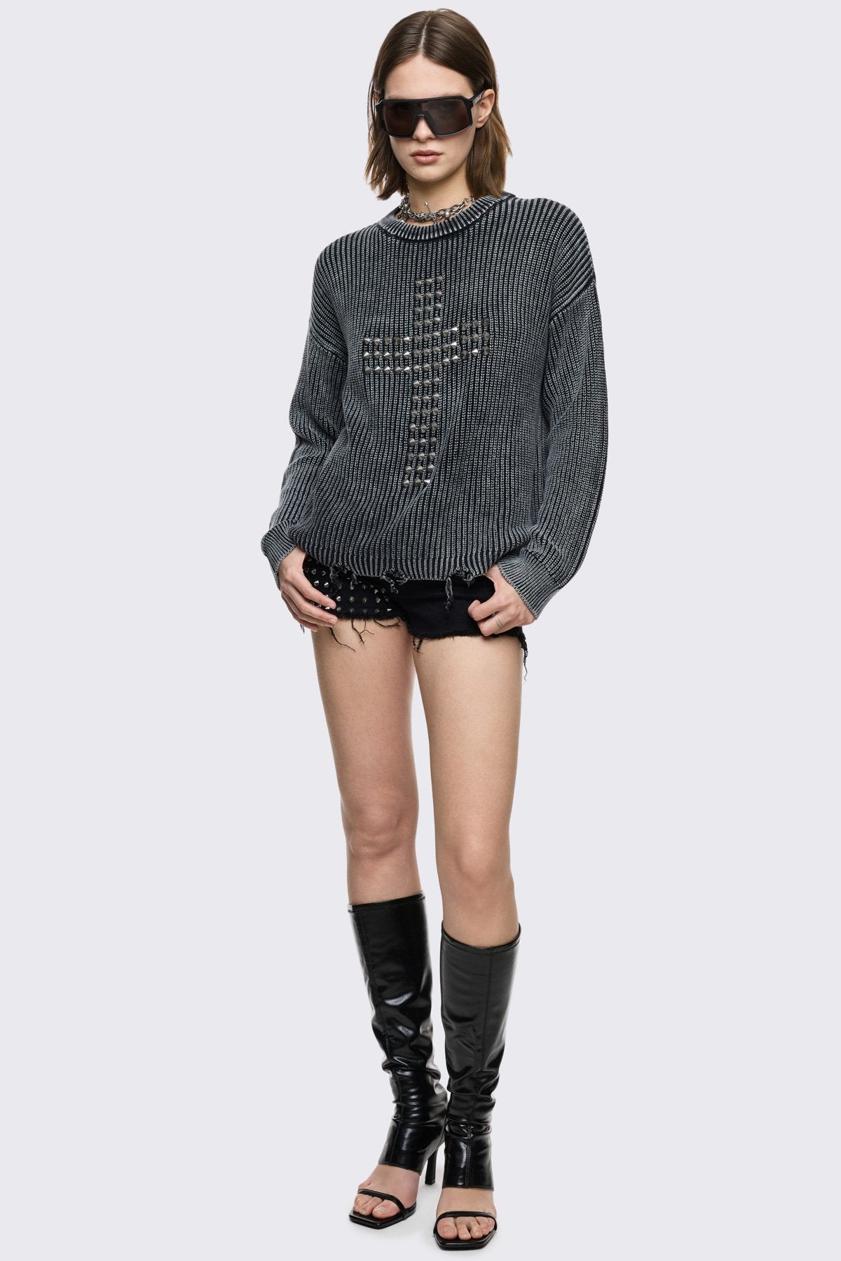 Black marl knit jumper with spiked cross design on front. 