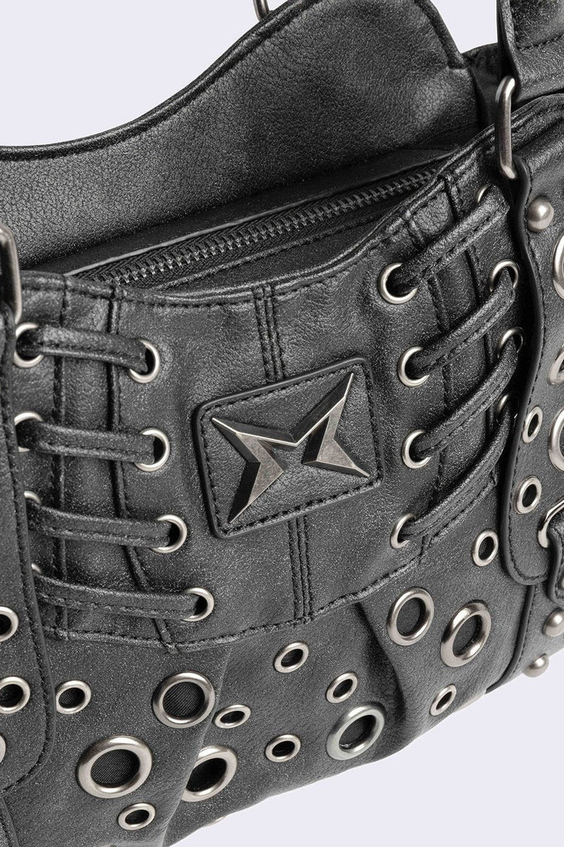 Black vegan leather shoulder bag with silver eyelets and multiple pockets