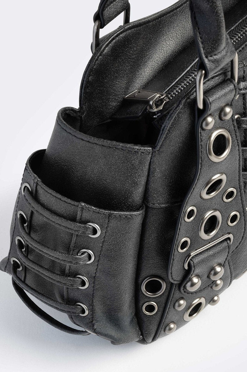 Black vegan leather shoulder bag with silver eyelets and multiple pockets