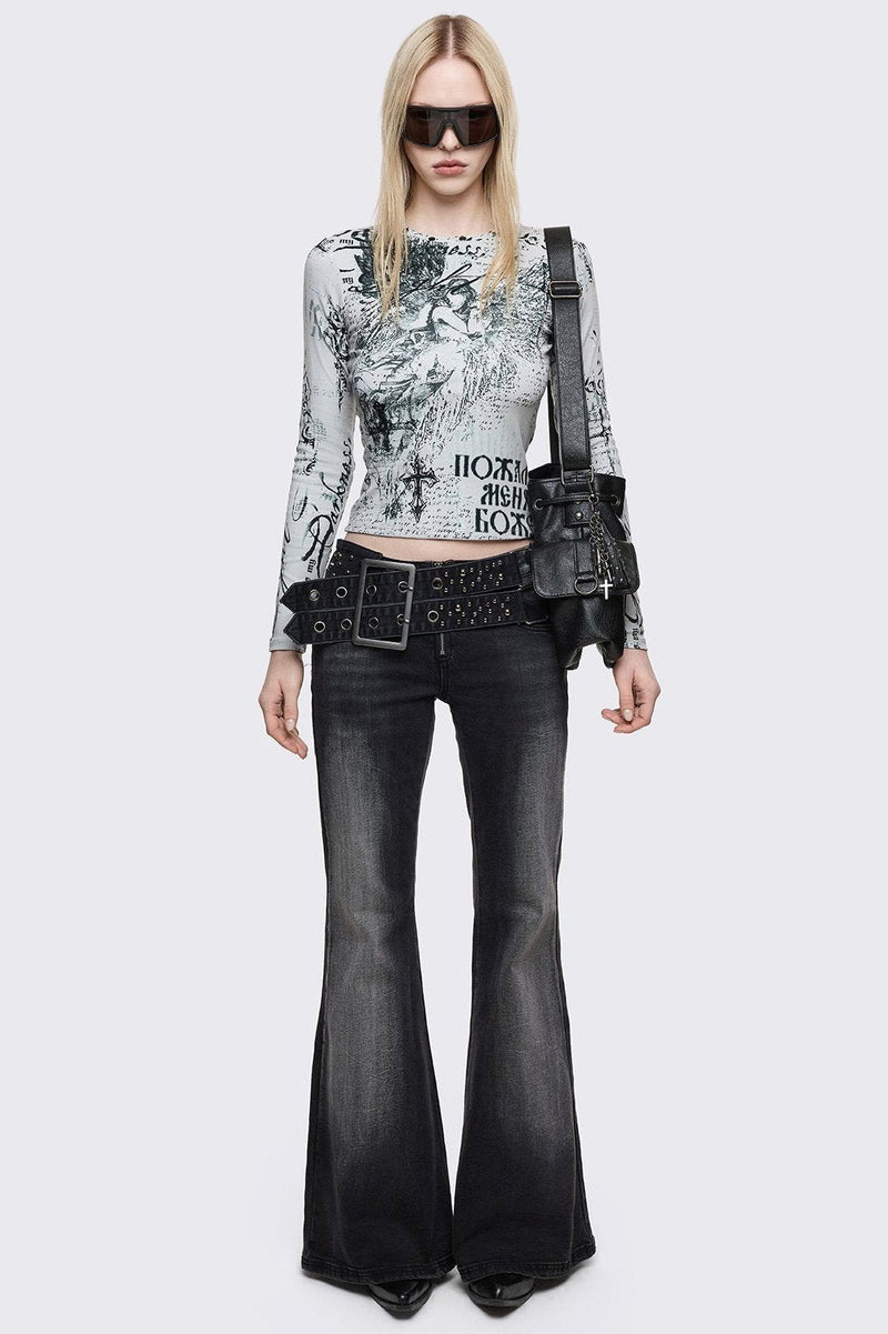 Grey washed flared jeans with double-buckle belt. 
