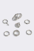 Silver set of 4 rings with cross designs.