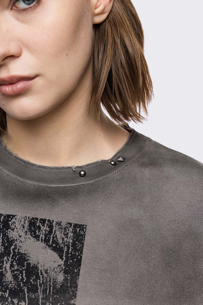 Grey cotton long sleeve T-shirt with cross graphic, studs and distressed hem in a grunge goth style.